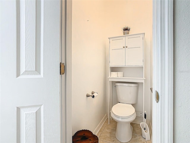 bathroom featuring tile patterned flooring and toilet