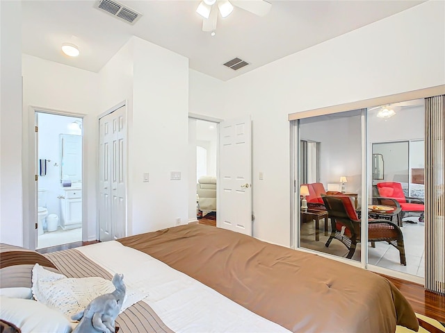 bedroom featuring ensuite bathroom, hardwood / wood-style floors, and ceiling fan