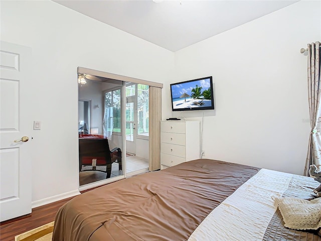 bedroom with hardwood / wood-style flooring and a closet