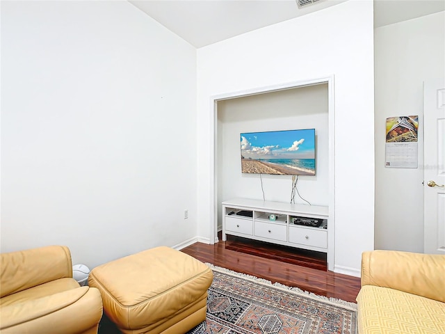 living room featuring dark wood-type flooring