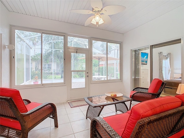 sunroom featuring ceiling fan