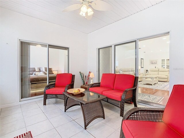 sunroom / solarium with ceiling fan and wood ceiling