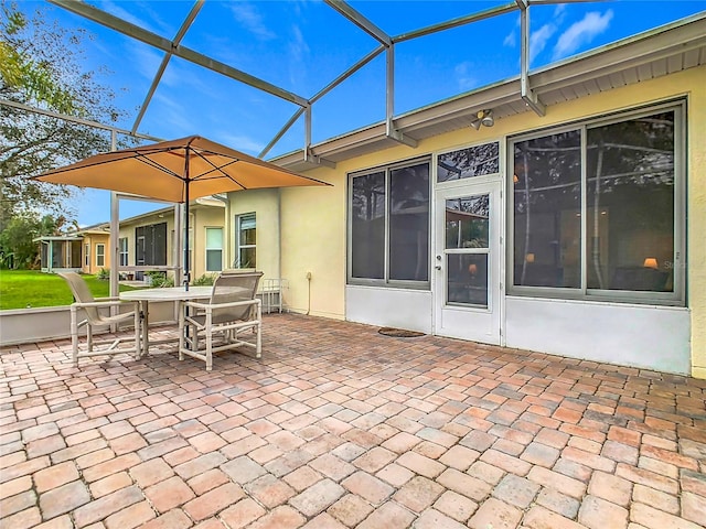 view of patio / terrace with glass enclosure