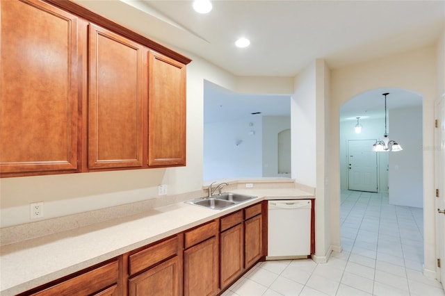 kitchen featuring dishwasher, light tile patterned floors, pendant lighting, and sink