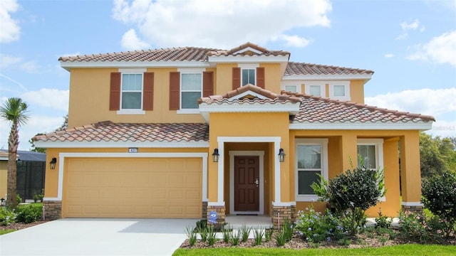 mediterranean / spanish-style home with a garage