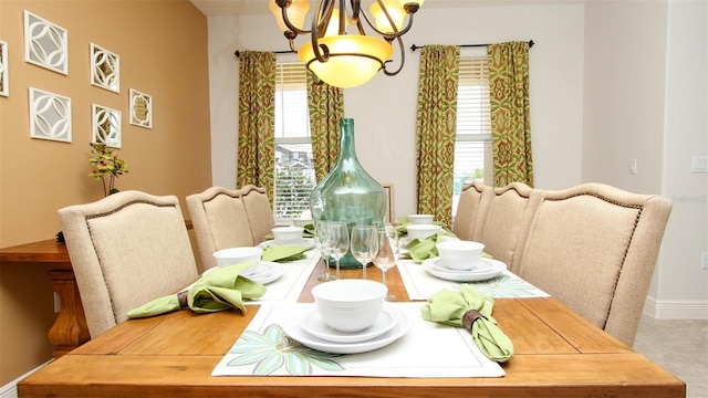 dining space featuring a chandelier