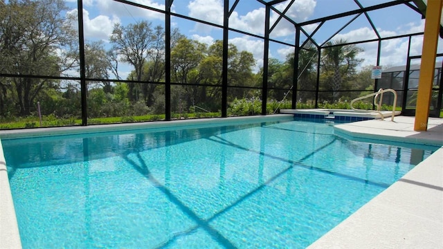 view of swimming pool with a lanai