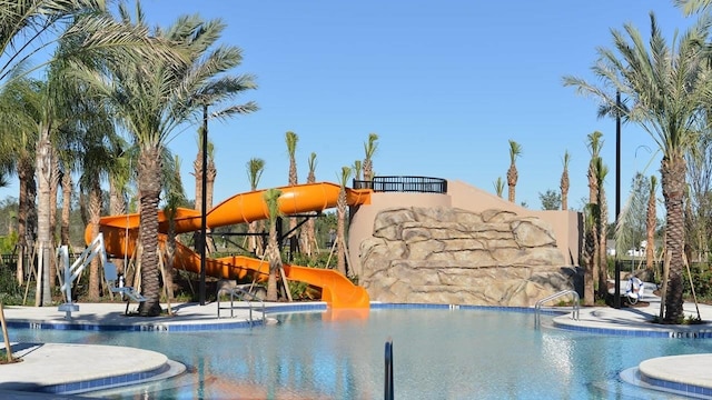 view of pool with a water slide