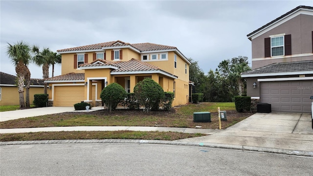 view of front of house featuring a garage and a front lawn