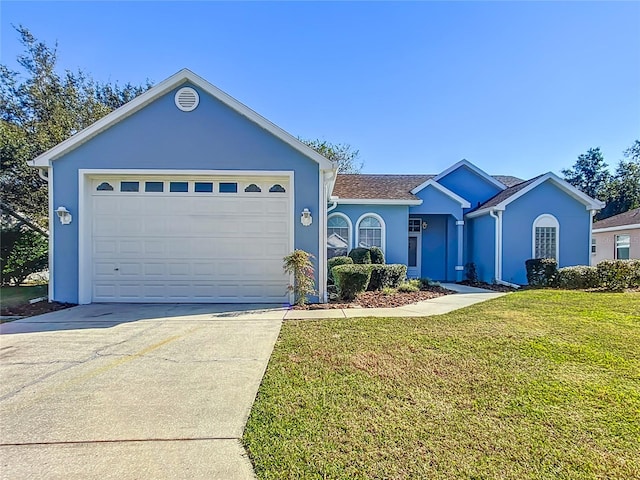 single story home with a garage and a front lawn