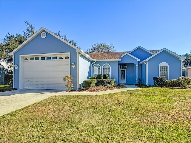 ranch-style house featuring a front yard and a garage