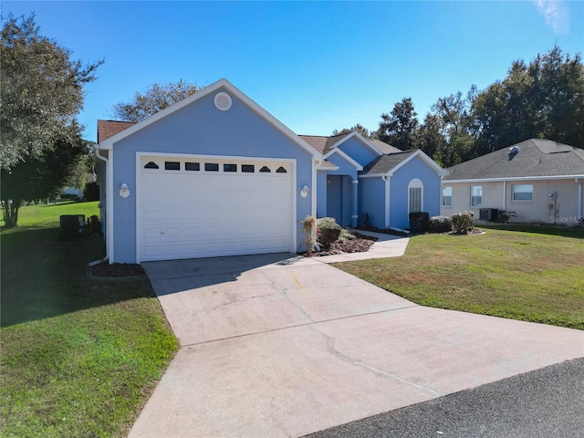 ranch-style house with a garage, a front lawn, and central air condition unit