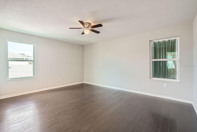 unfurnished room featuring ceiling fan, dark hardwood / wood-style flooring, and a textured ceiling