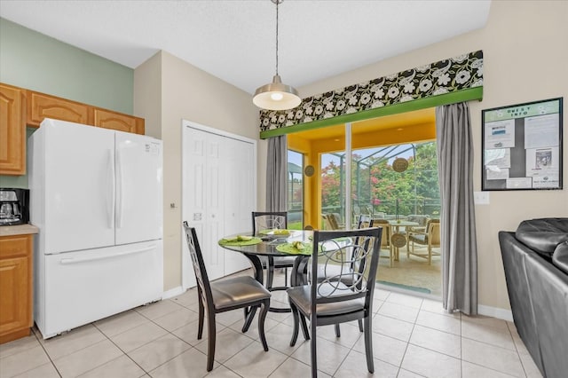 dining area featuring light tile patterned floors