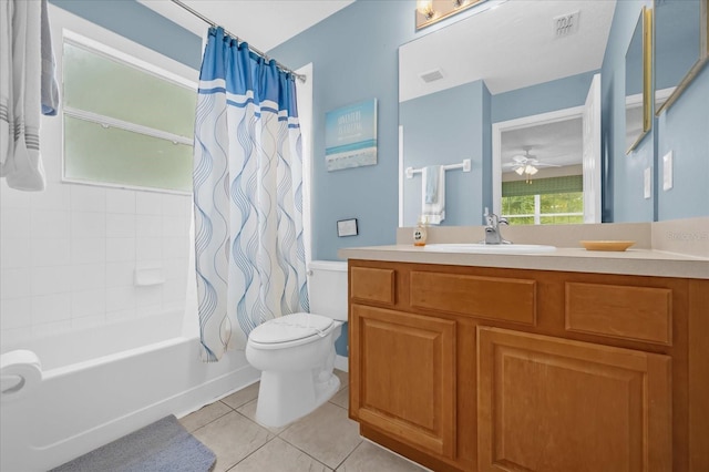 full bathroom featuring tile patterned floors, vanity, ceiling fan, shower / bath combo with shower curtain, and toilet