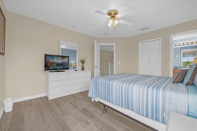 bedroom with light wood-type flooring, a closet, and ceiling fan