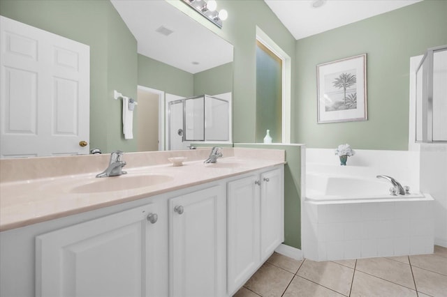 bathroom with tile patterned flooring, vanity, and separate shower and tub