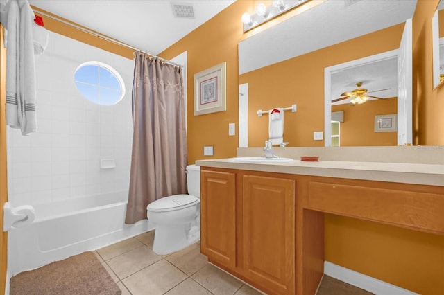 full bathroom featuring ceiling fan, tile patterned floors, toilet, shower / tub combo with curtain, and vanity