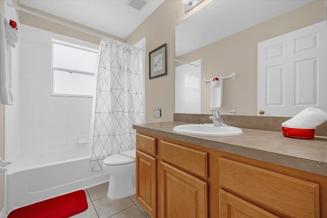 full bathroom featuring tile patterned floors, shower / bath combo, toilet, and vanity