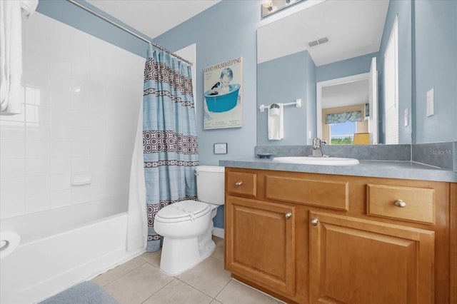 full bathroom featuring tile patterned floors, vanity, shower / bath combination with curtain, and toilet