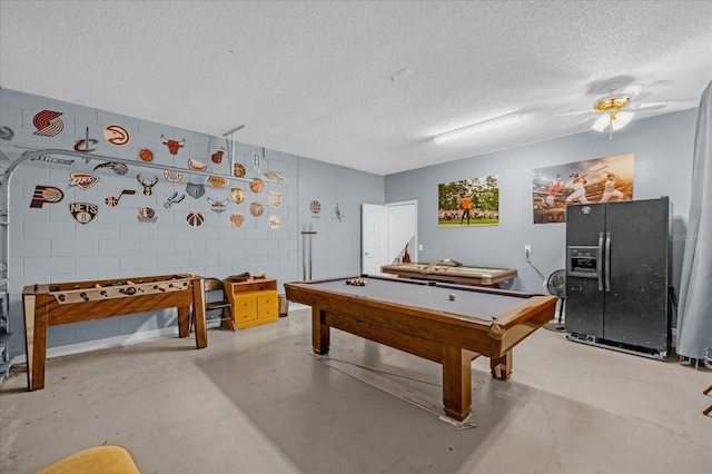 rec room featuring ceiling fan, a textured ceiling, pool table, and concrete floors