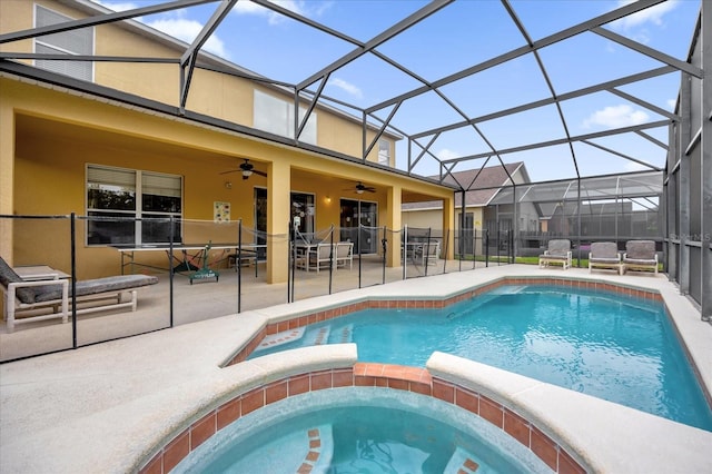 view of pool featuring an in ground hot tub, a patio, ceiling fan, and a lanai