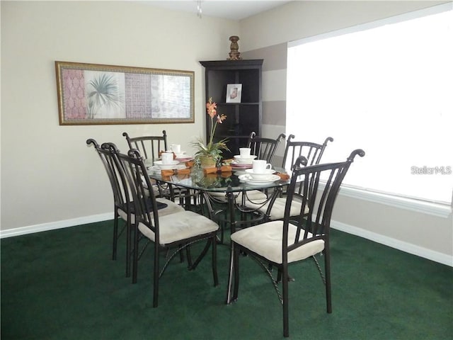 view of carpeted dining space