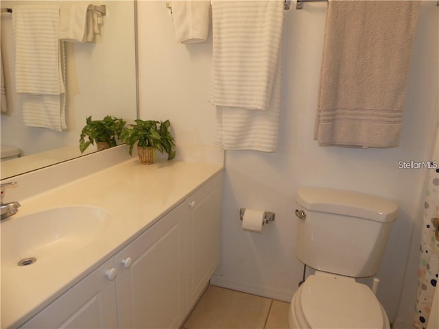 bathroom with tile patterned floors, vanity, and toilet