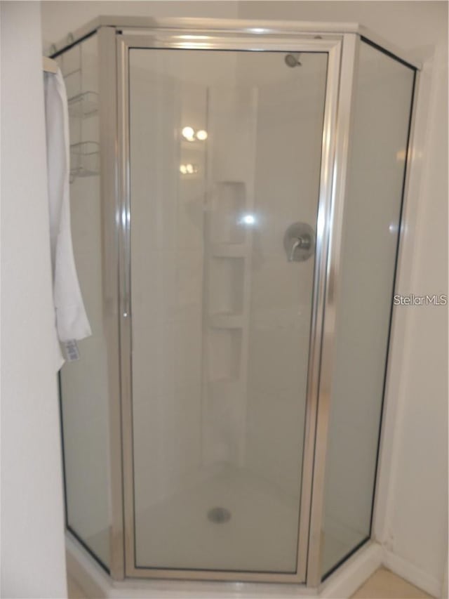 bathroom featuring walk in shower