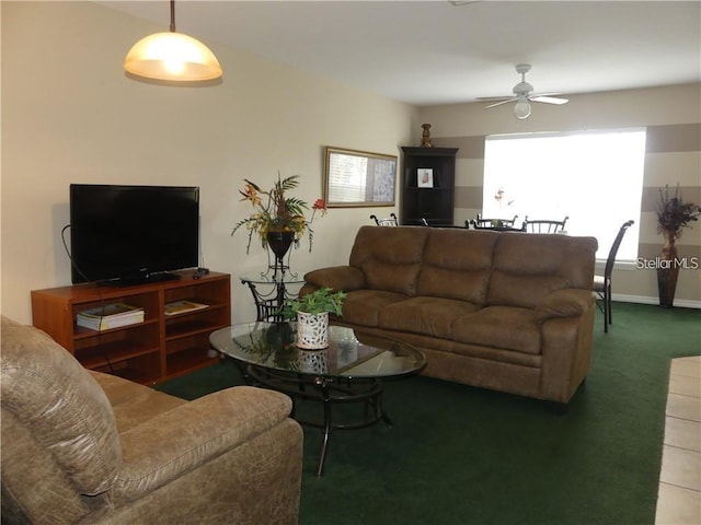 carpeted living room featuring ceiling fan