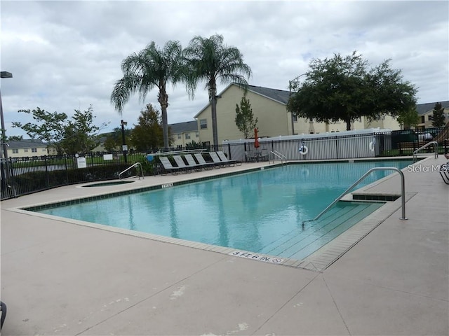 view of swimming pool with a patio