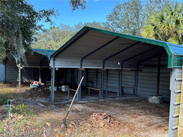 view of outbuilding with a carport