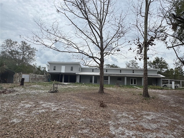 rear view of house with fence