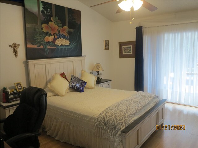 bedroom featuring hardwood / wood-style flooring and ceiling fan