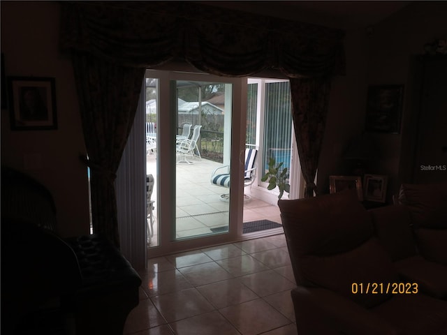 entryway with light tile patterned floors