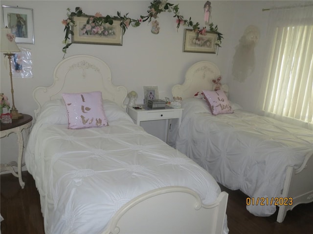 bedroom featuring dark wood-type flooring