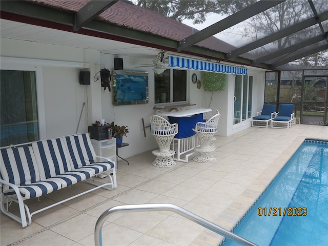 view of patio / terrace with an outdoor living space and glass enclosure