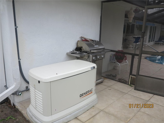 laundry area with light tile patterned flooring