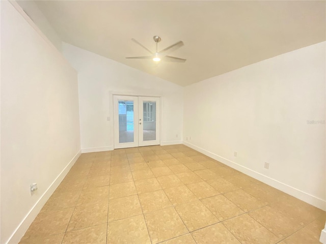 unfurnished room featuring ceiling fan, french doors, light tile patterned flooring, and lofted ceiling