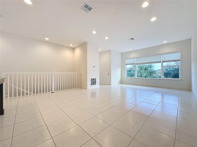 spare room with light tile patterned flooring