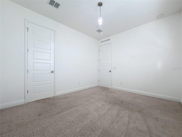 unfurnished room featuring carpet