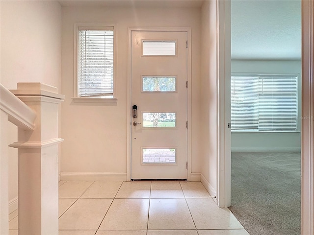 entryway with light carpet