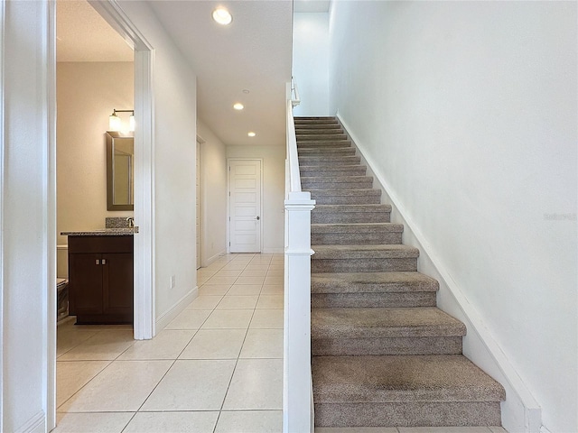 stairs with tile patterned flooring