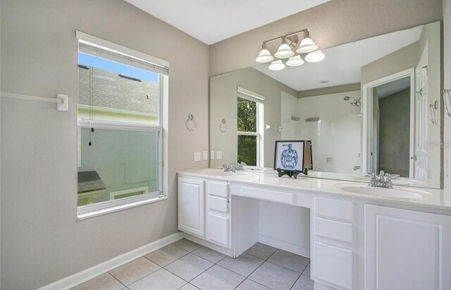 bathroom with vanity, tile patterned floors, and an enclosed shower