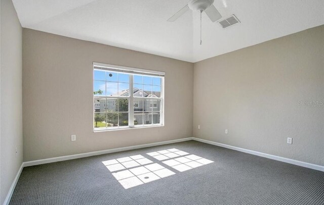 empty room with ceiling fan and carpet floors