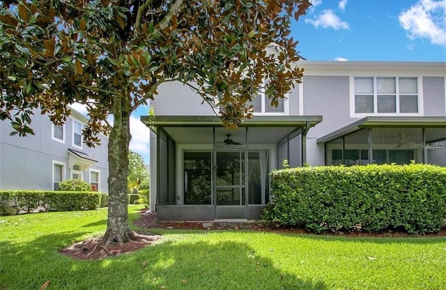 rear view of house with a lawn