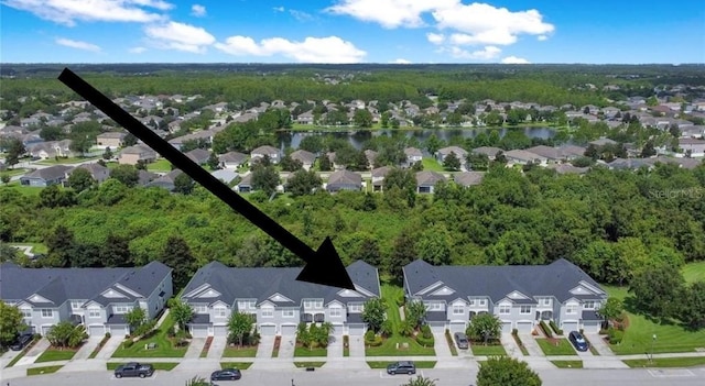 birds eye view of property featuring a water view