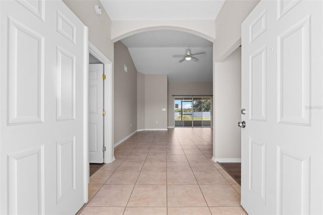 corridor with light tile patterned flooring