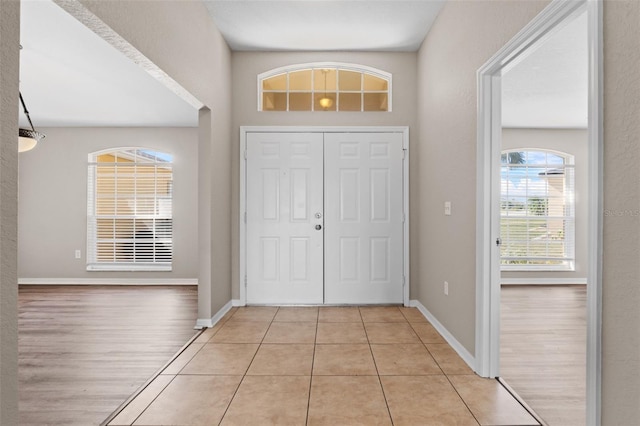 foyer entrance with light hardwood / wood-style flooring