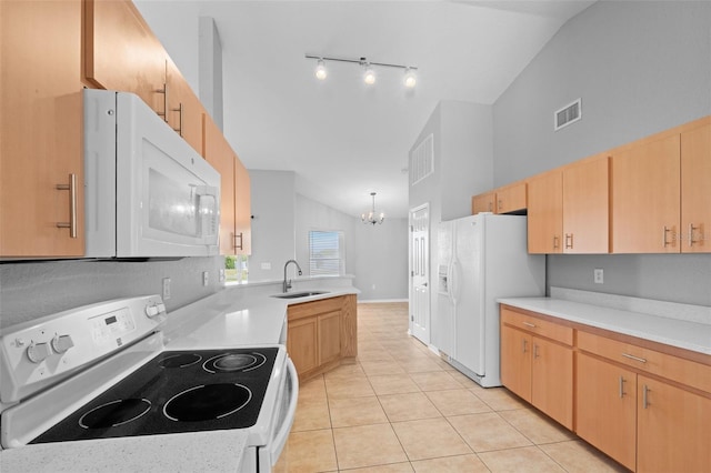 kitchen featuring light brown cabinets, light tile patterned floors, pendant lighting, and white appliances